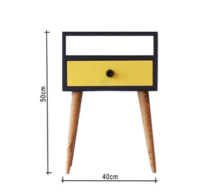 Black dresser with yellow drawer