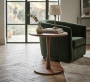 Round serving table with a warm wood design