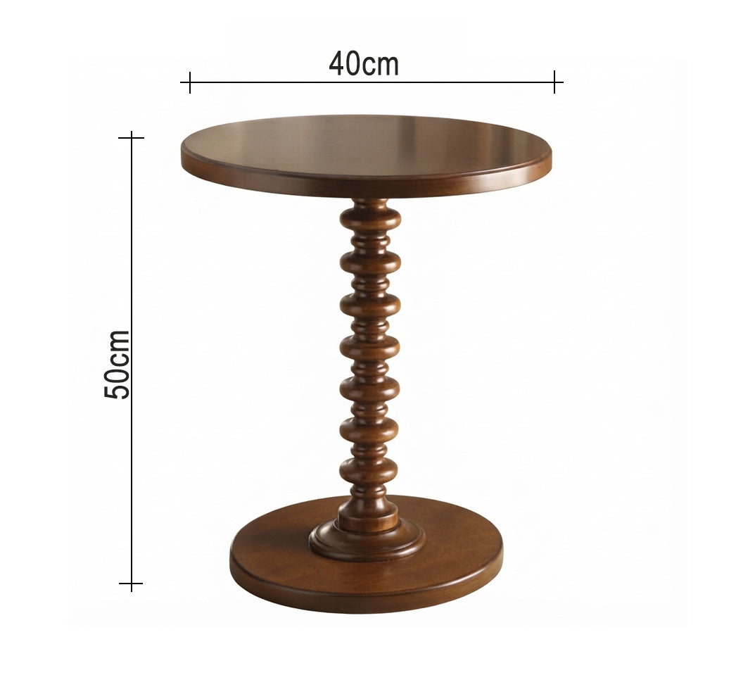 Round serving table with a classic turned design