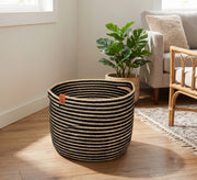 Round storage basket featuring contrasting horizontal stripes