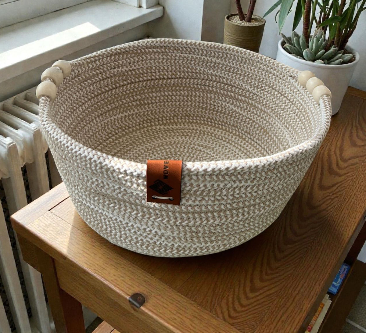 Low round basket with leather handles and cheerful colors