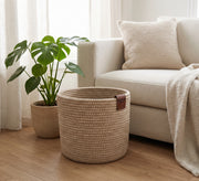 Round plant holder with a distinctive woven texture