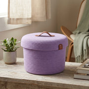 Round box with a lid and a leather handle