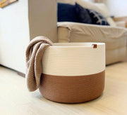 Two-tone round storage basket featuring a small tag