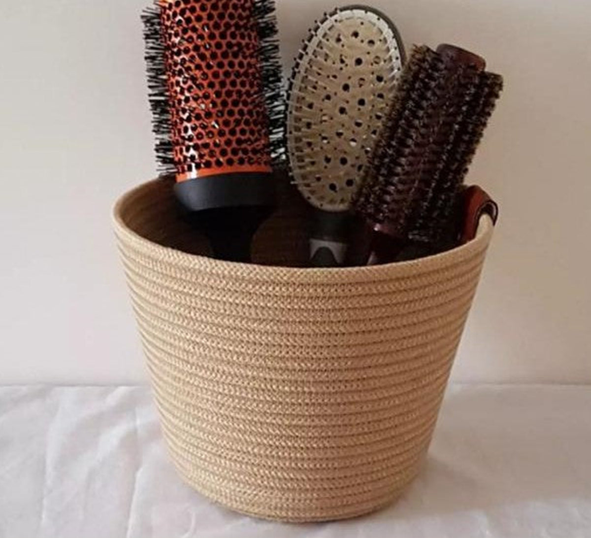 Round jute basket for organizing hairbrushes