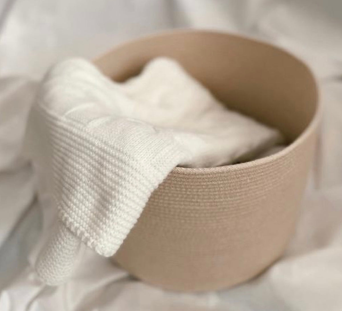 Round basket with a soft weave and a calm muted color