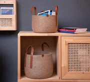 Round jute basket with top leather handles