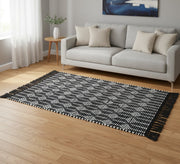 A black rug with white patterns and elegant fringe. - Vitrine Furniture - Accessories