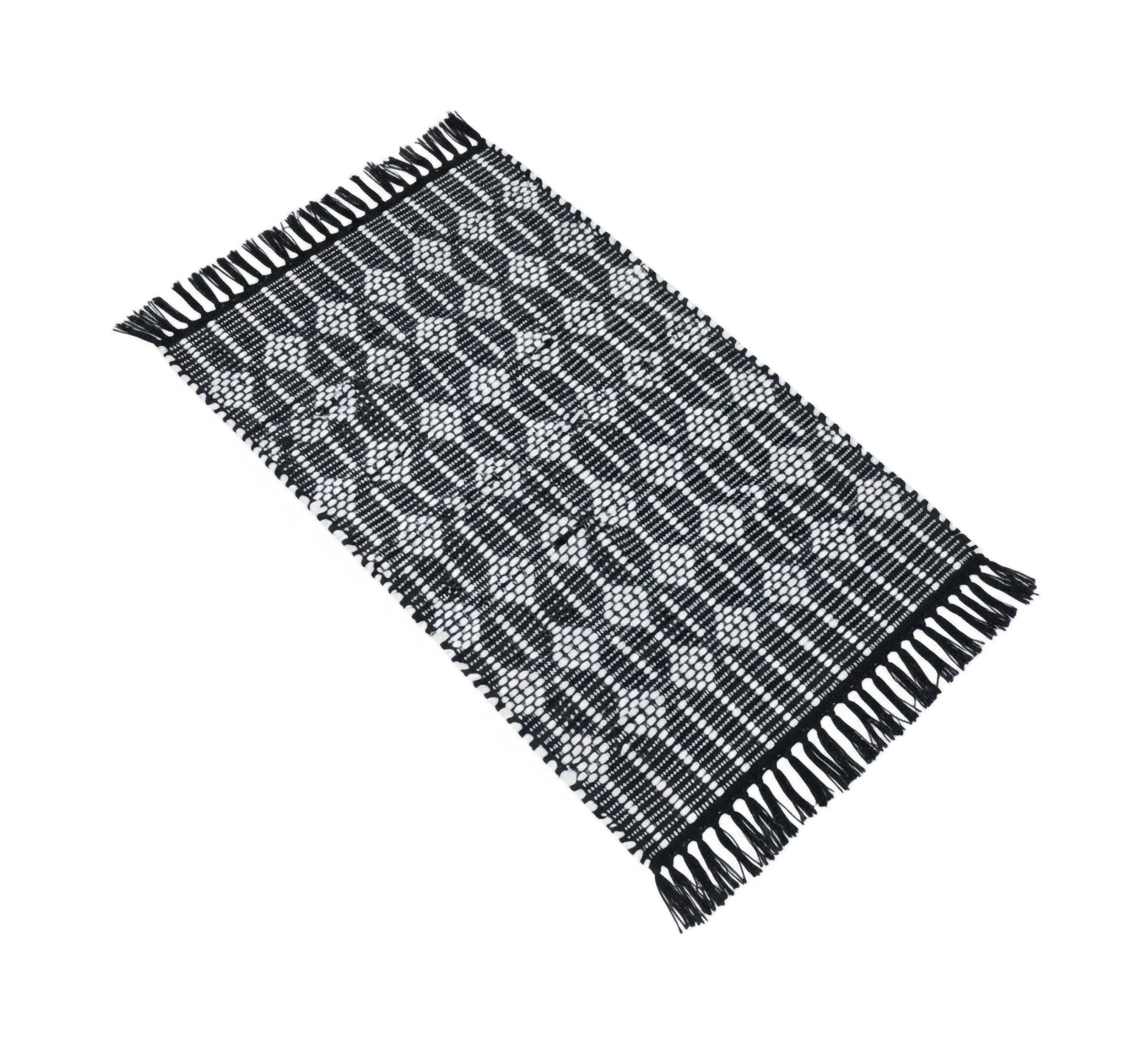 A black rug with white patterns and elegant fringe. - Vitrine Furniture - Accessories