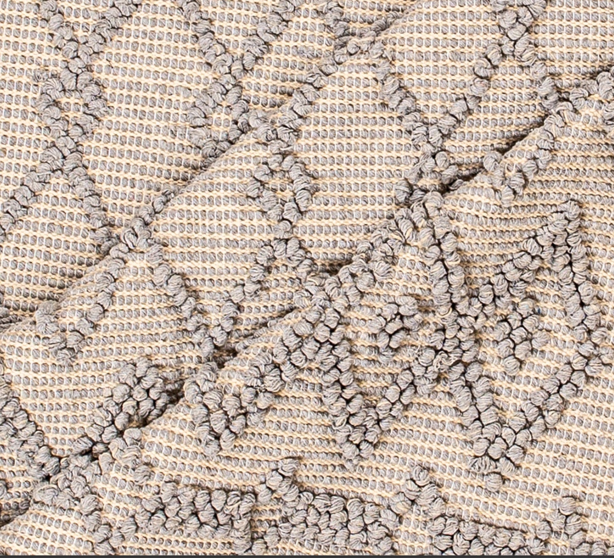 A gray rug with a raised, interlocking diamond pattern - Vitrine Furniture - Accessories