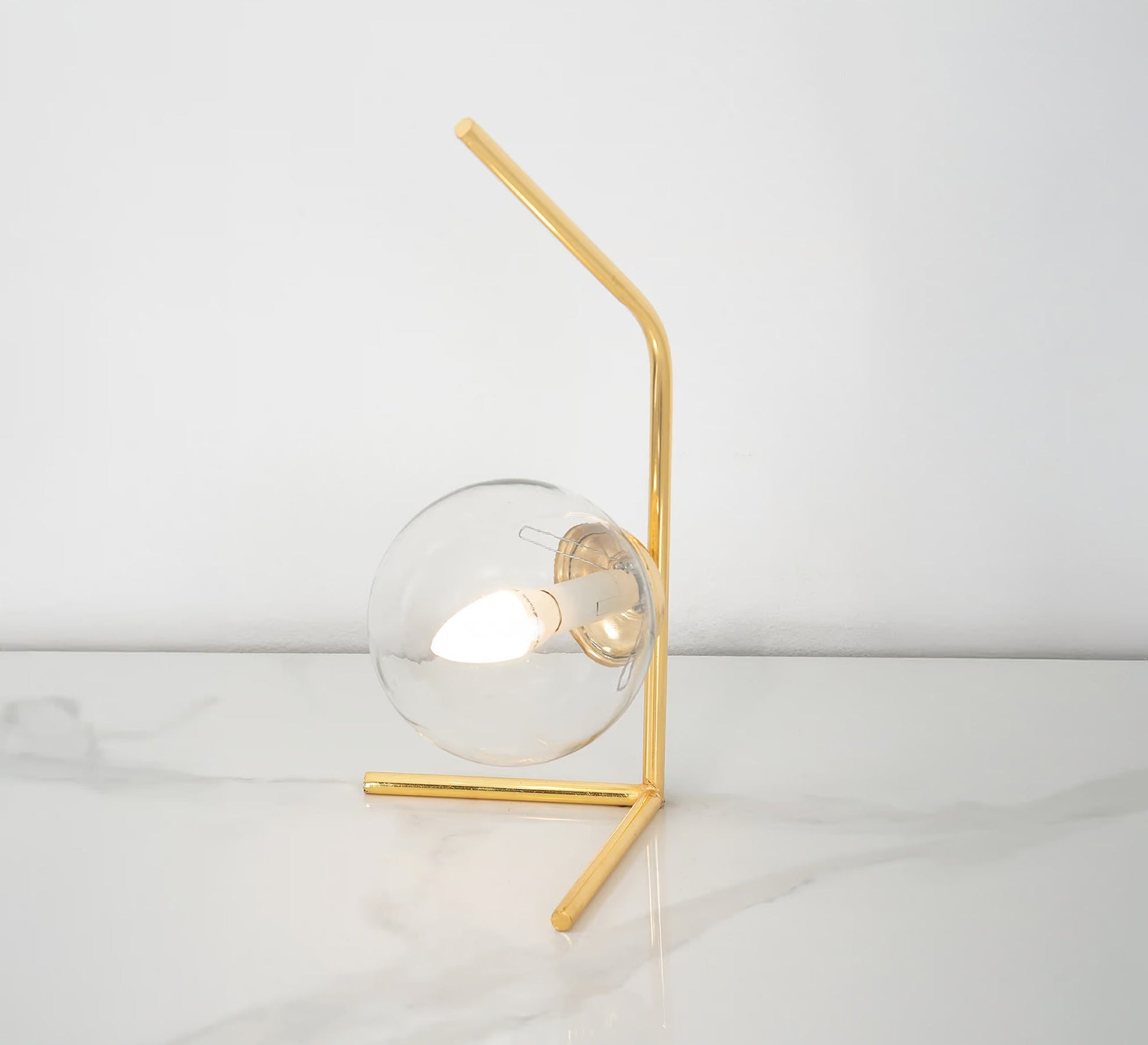 A lamp with a uniquely designed curved arm - Vitrine Furniture - Table lamps