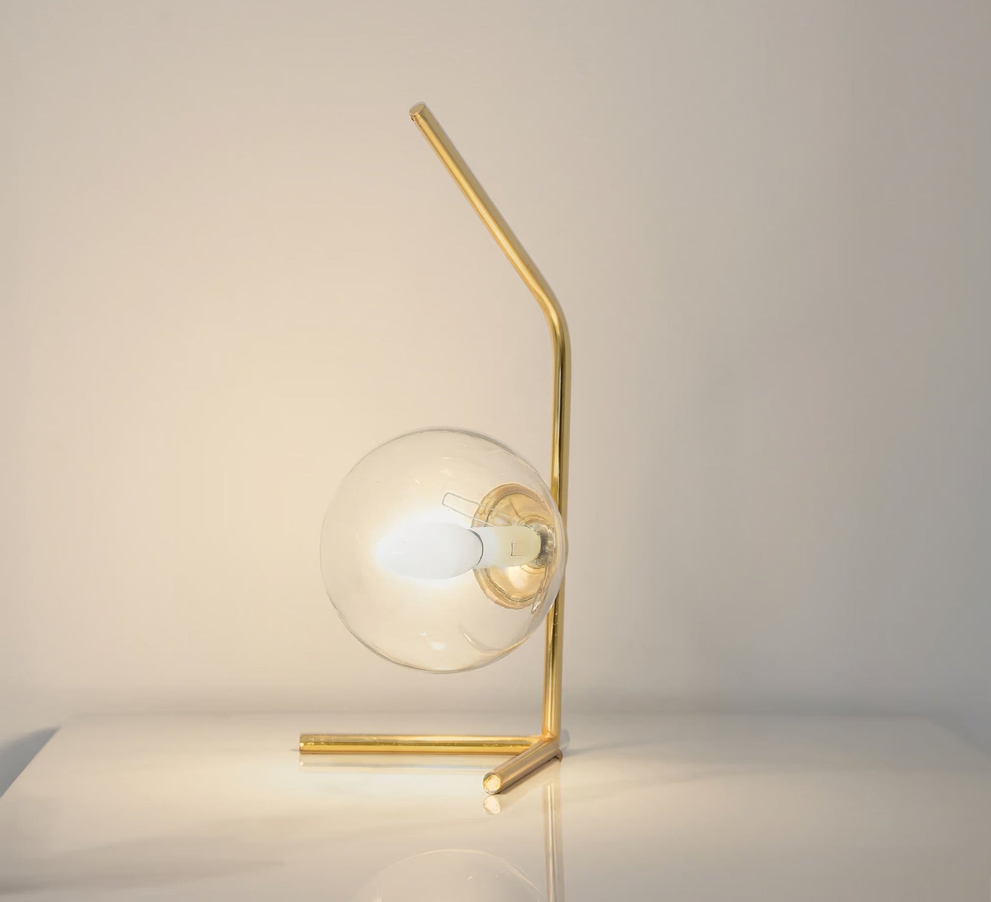 A lamp with a uniquely designed curved arm - Vitrine Furniture - Table lamps