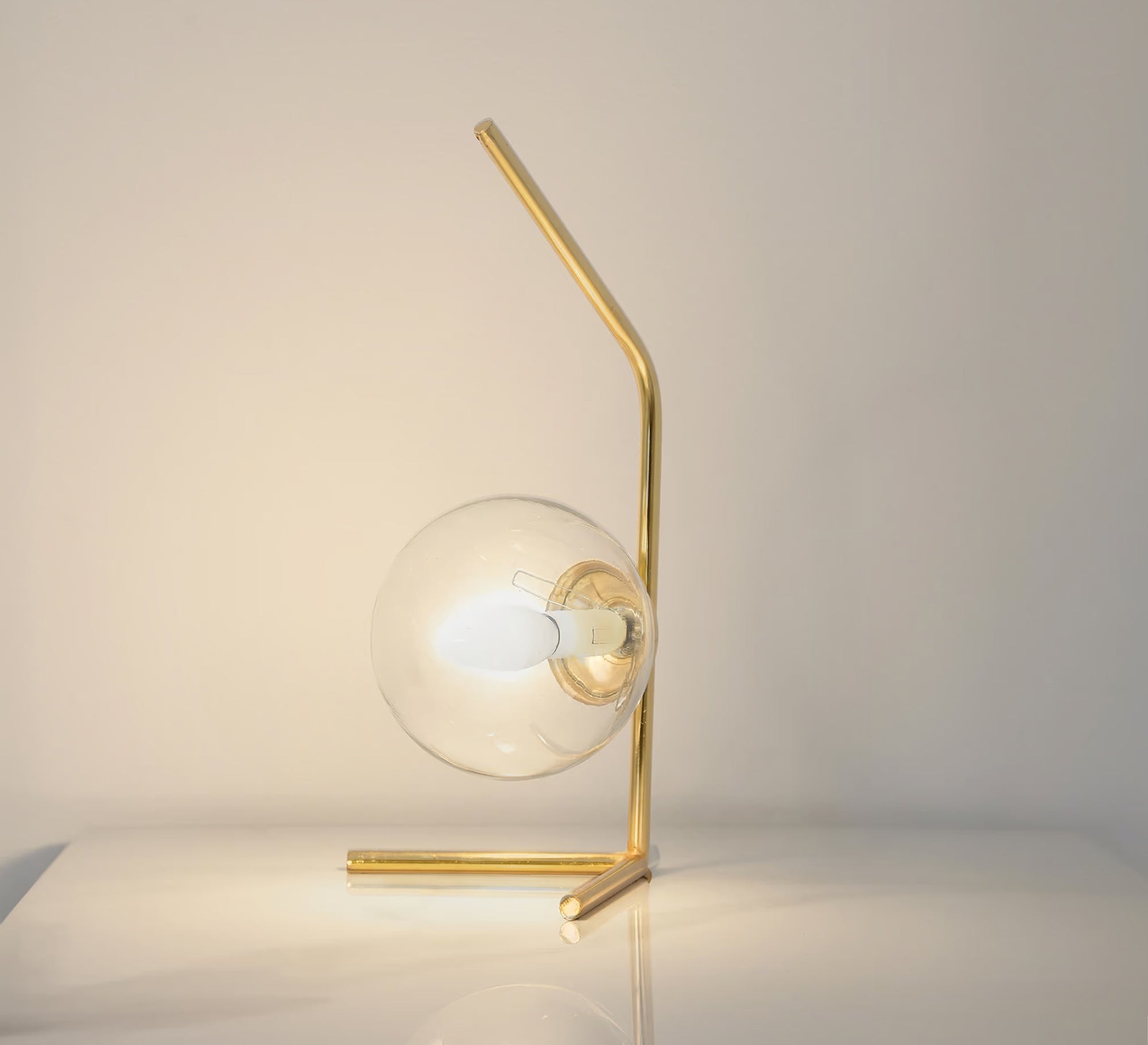 A lamp with a uniquely designed curved arm - Vitrine Furniture - Table lamps