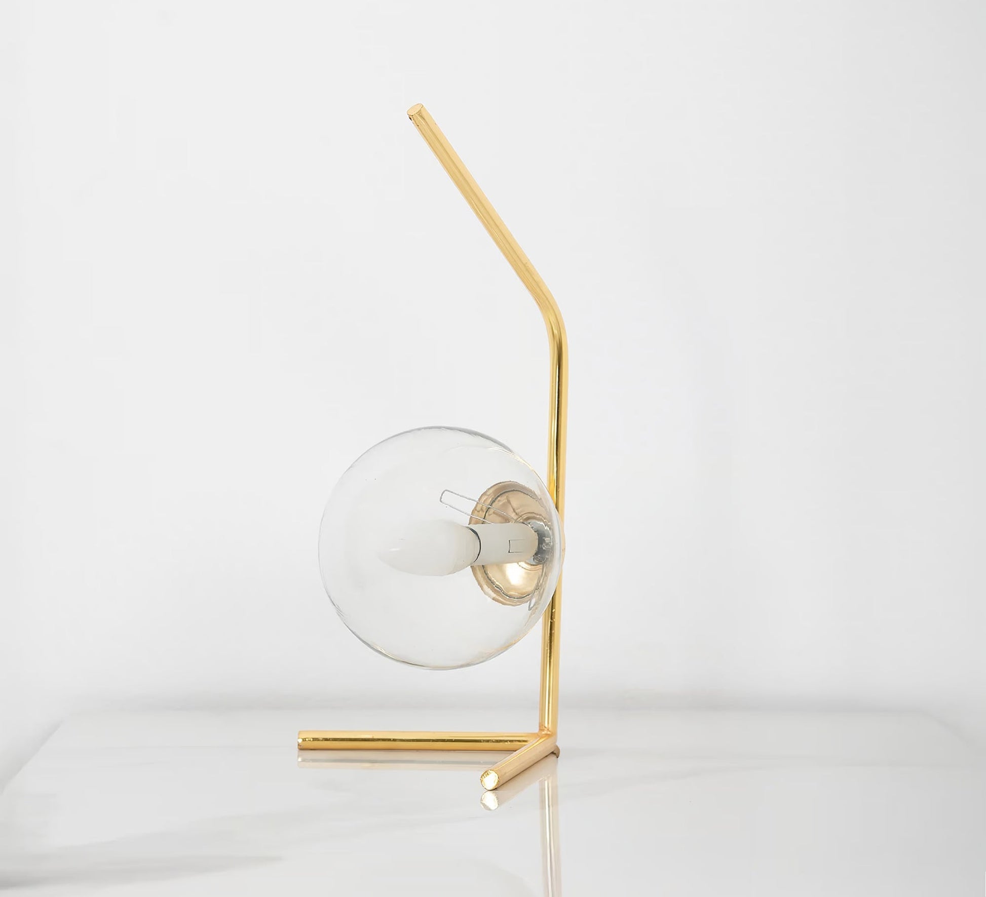 A lamp with a uniquely designed curved arm - Vitrine Furniture - Table lamps