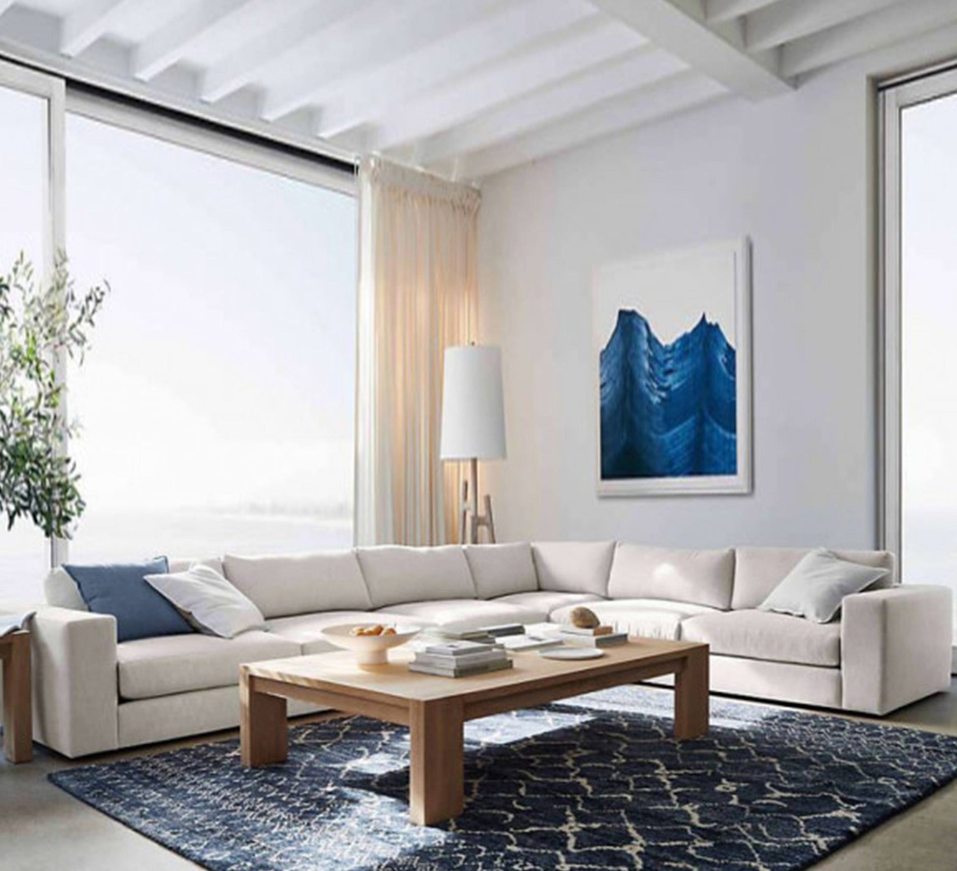 A large off - white corner - Vitrine Furniture - L - shape sofa set