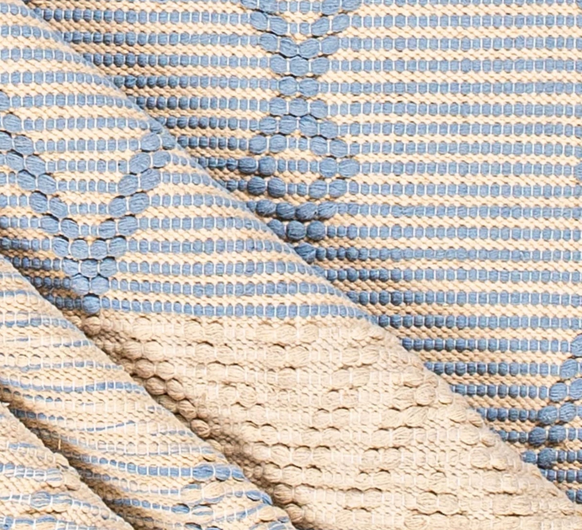 A modern, light blue rug with diamond and striped patterns - Vitrine Furniture - Accessories