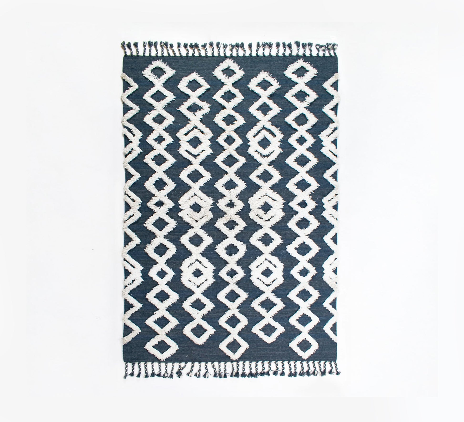 A navy rug that offers depth and comfort through its diamond pattern and textured pile - Vitrine Furniture - Accessories