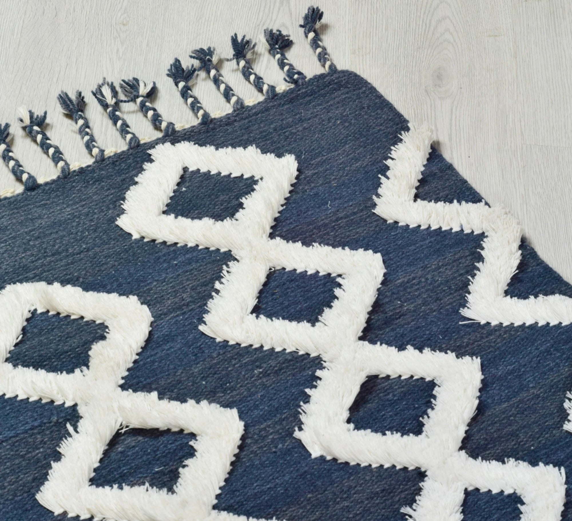 A navy rug that offers depth and comfort through its diamond pattern and textured pile - Vitrine Furniture - Accessories