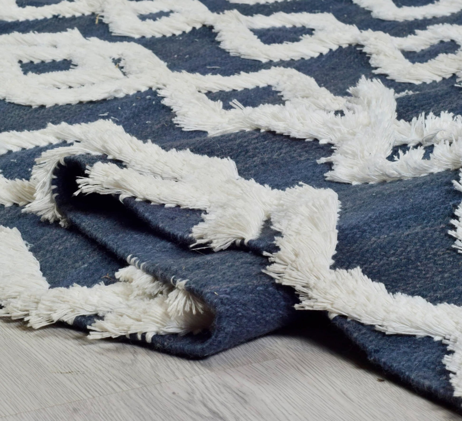 A navy rug that offers depth and comfort through its diamond pattern and textured pile - Vitrine Furniture - Accessories