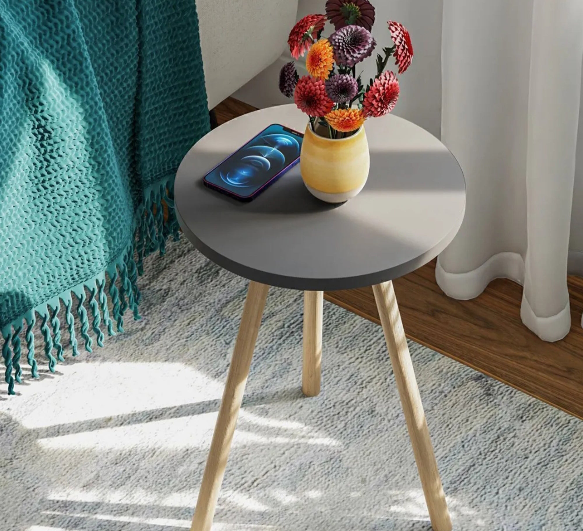A round table adds a warm touch to the relaxation corner. - Vitrine Furniture - Side Tables