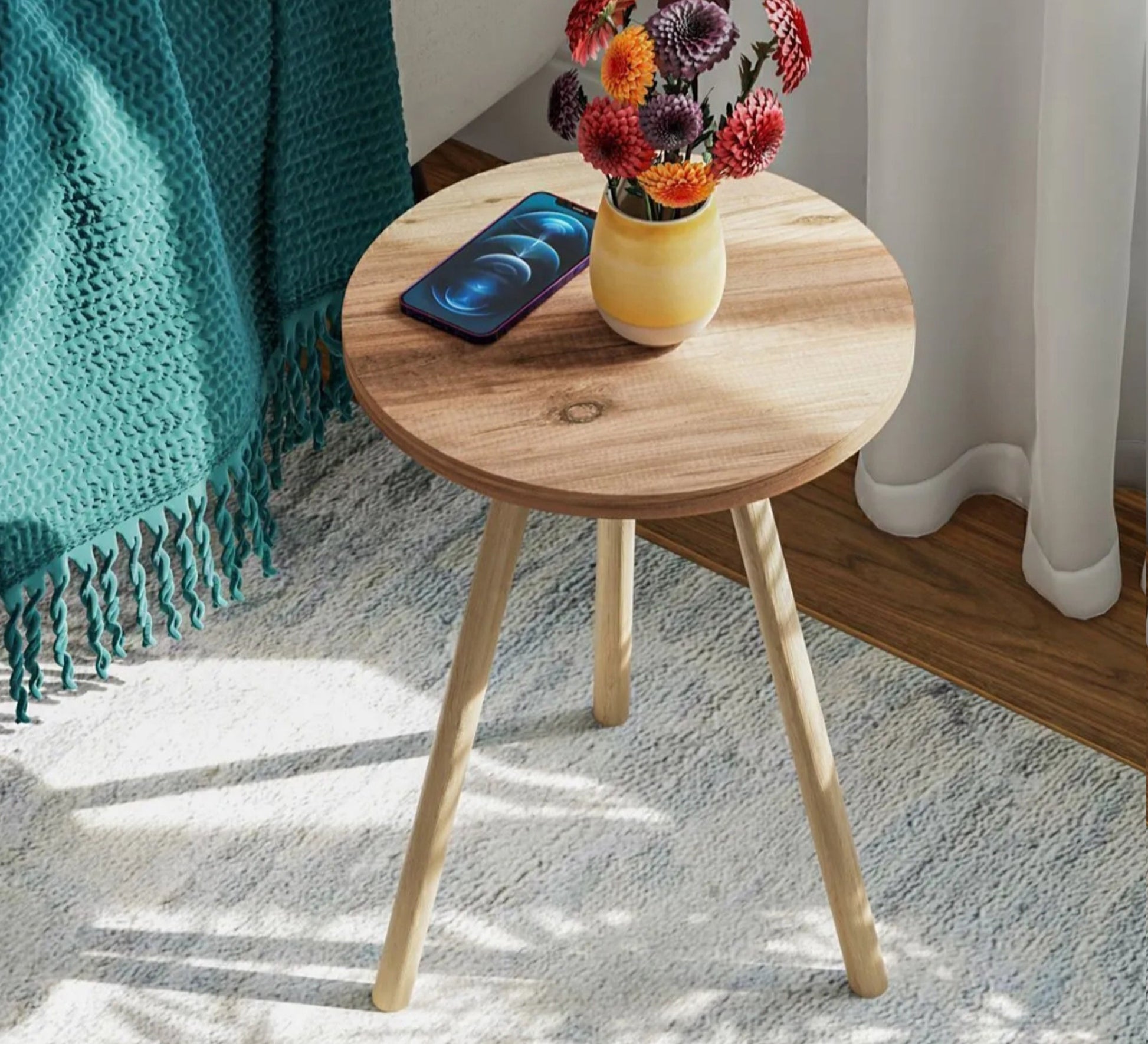 A round table adds a warm touch to the relaxation corner. - Vitrine Furniture - Side Tables