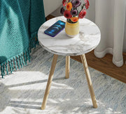 A round table adds a warm touch to the relaxation corner. - Vitrine Furniture - Side Tables