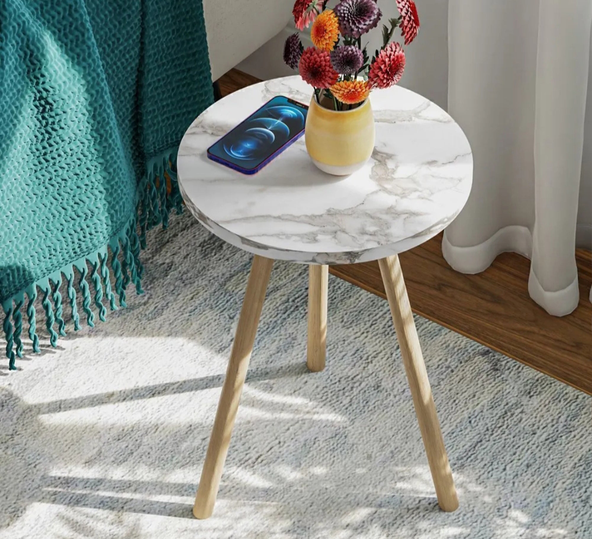 A round table adds a warm touch to the relaxation corner. - Vitrine Furniture - Side Tables
