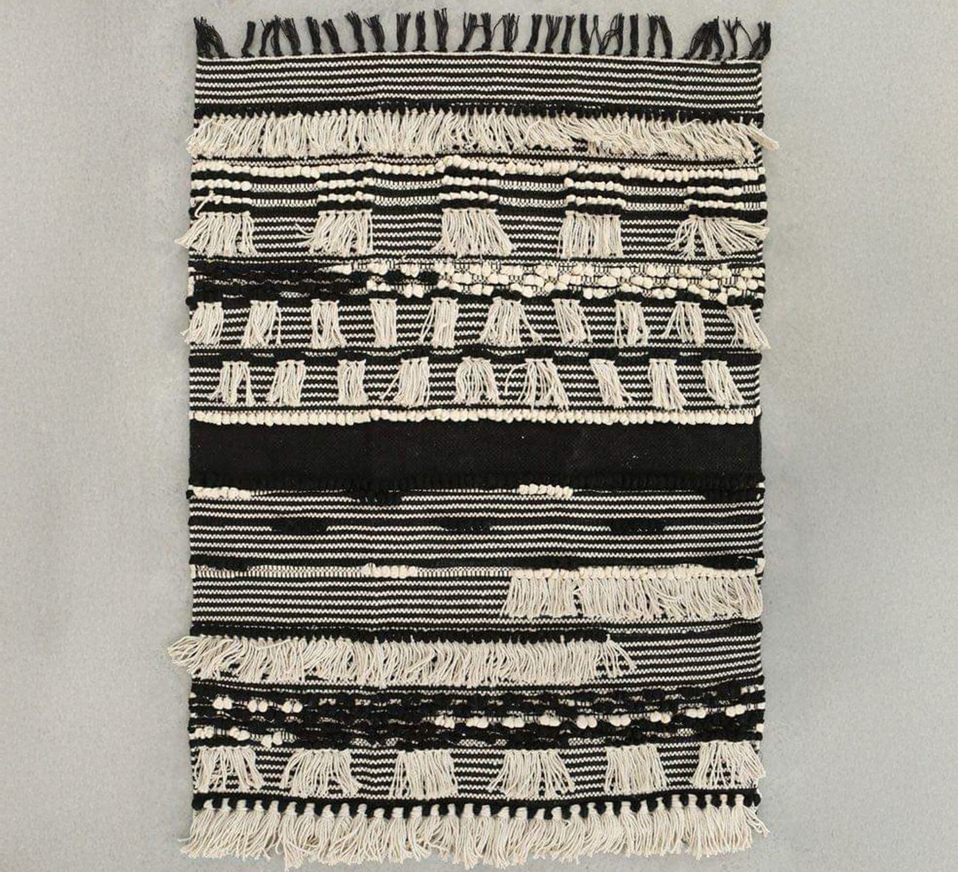 A rug with a rich design featuring woven and embossed patterns - Vitrine Furniture - Accessories