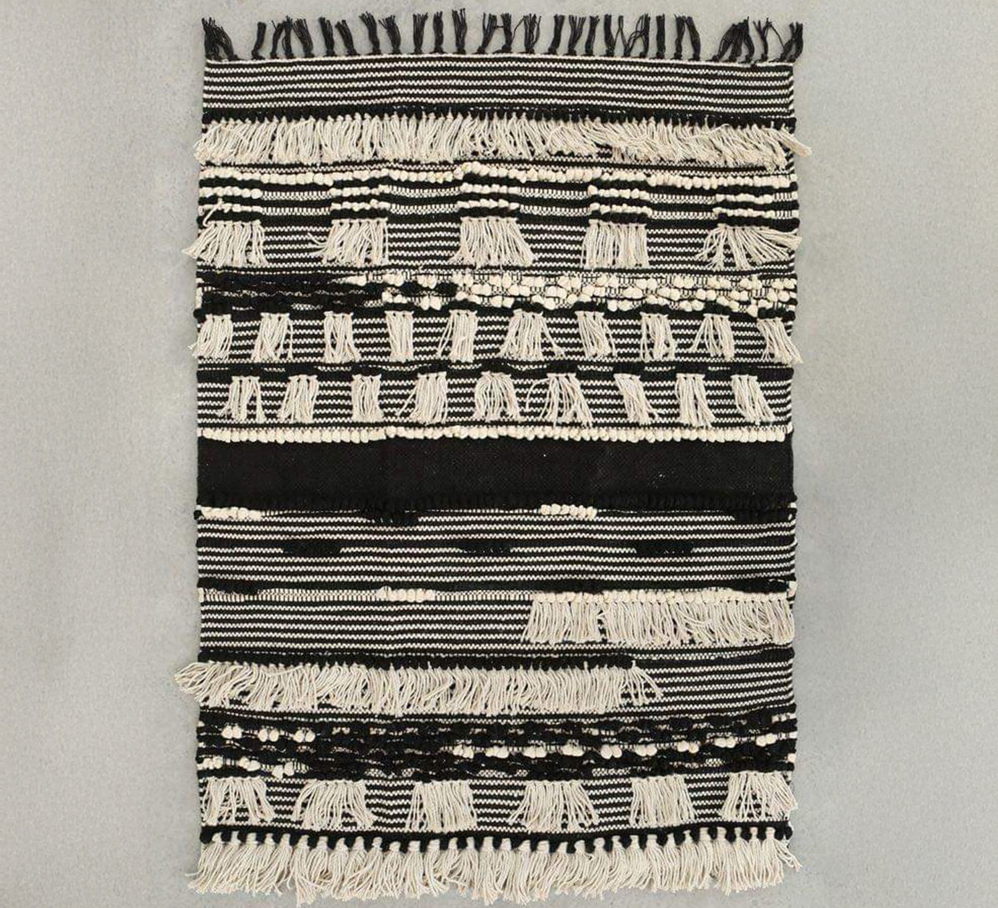 A rug with a rich design featuring woven and embossed patterns - Vitrine Furniture - Accessories