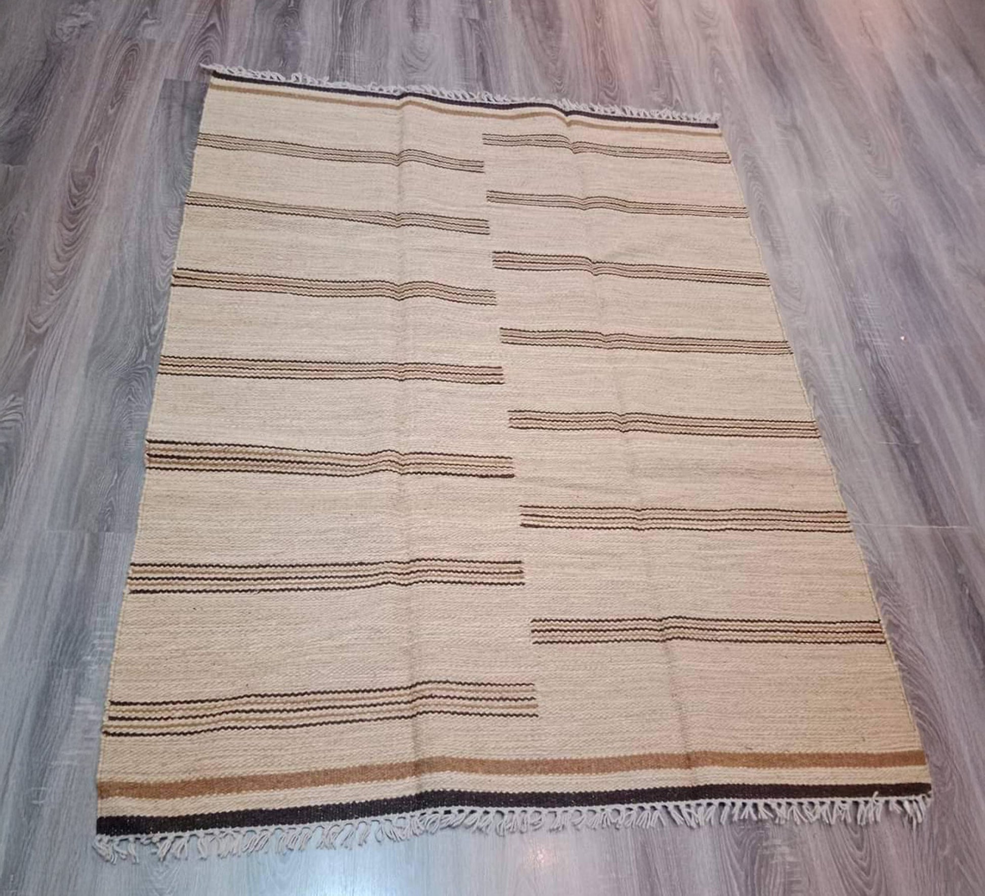 A rug with a subtle gradient, featuring thin brown lines and a white background - Vitrine Furniture - Accessories