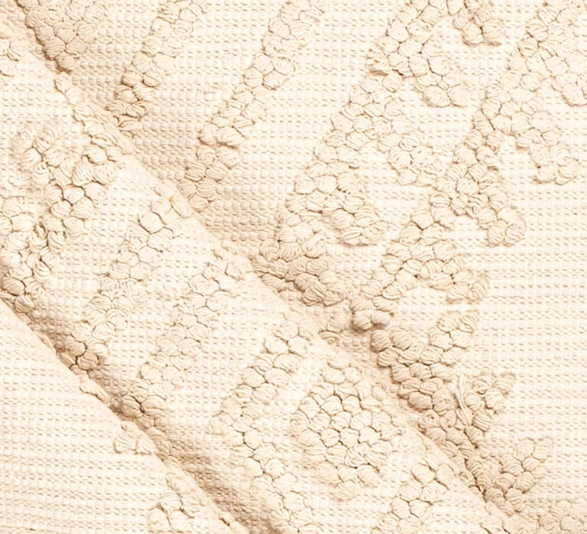 A soft white rug with a distinctive texture and prominent diamond patterns - Vitrine Furniture - Accessories