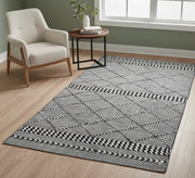 Black and gray rug with a repeating diagonal pattern - Vitrine Furniture - Accessories