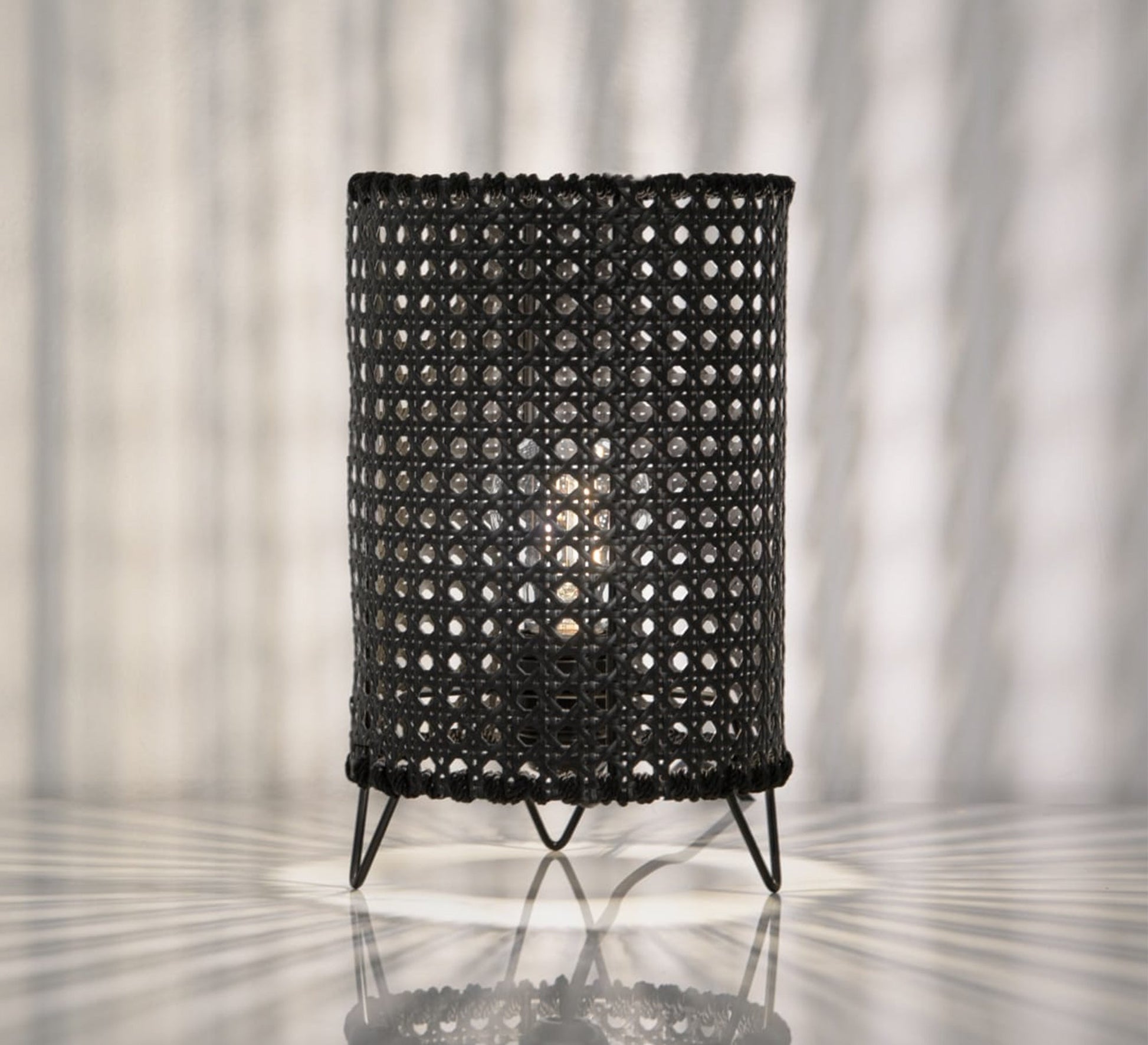 Black cylindrical table lighting with a hollow grid pattern - Vitrine Furniture - Lighting