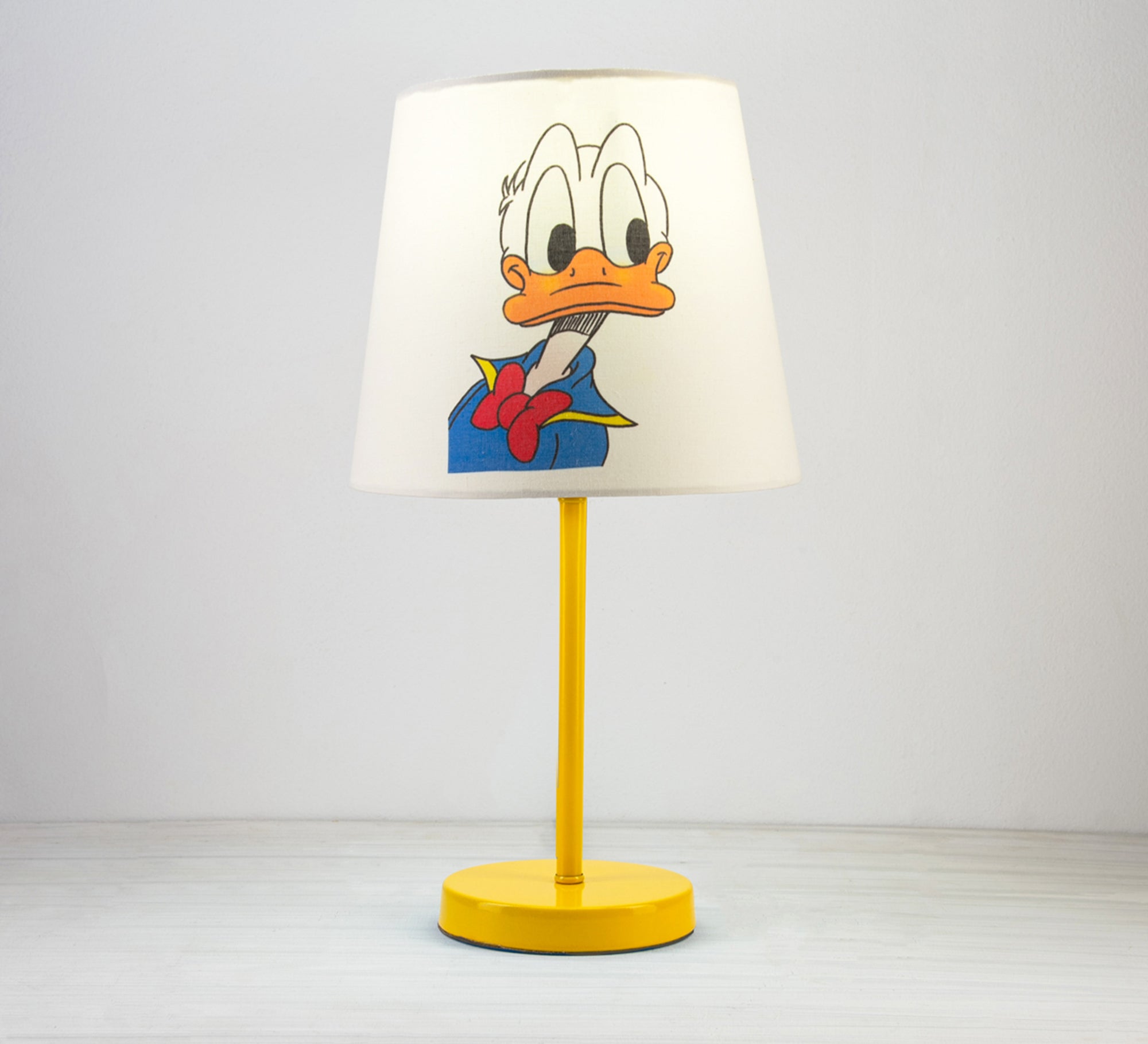 Donald Duck Lamp: A fun, classic touch for a kid's room with a golden base. - Vitrine Furniture - Lighting