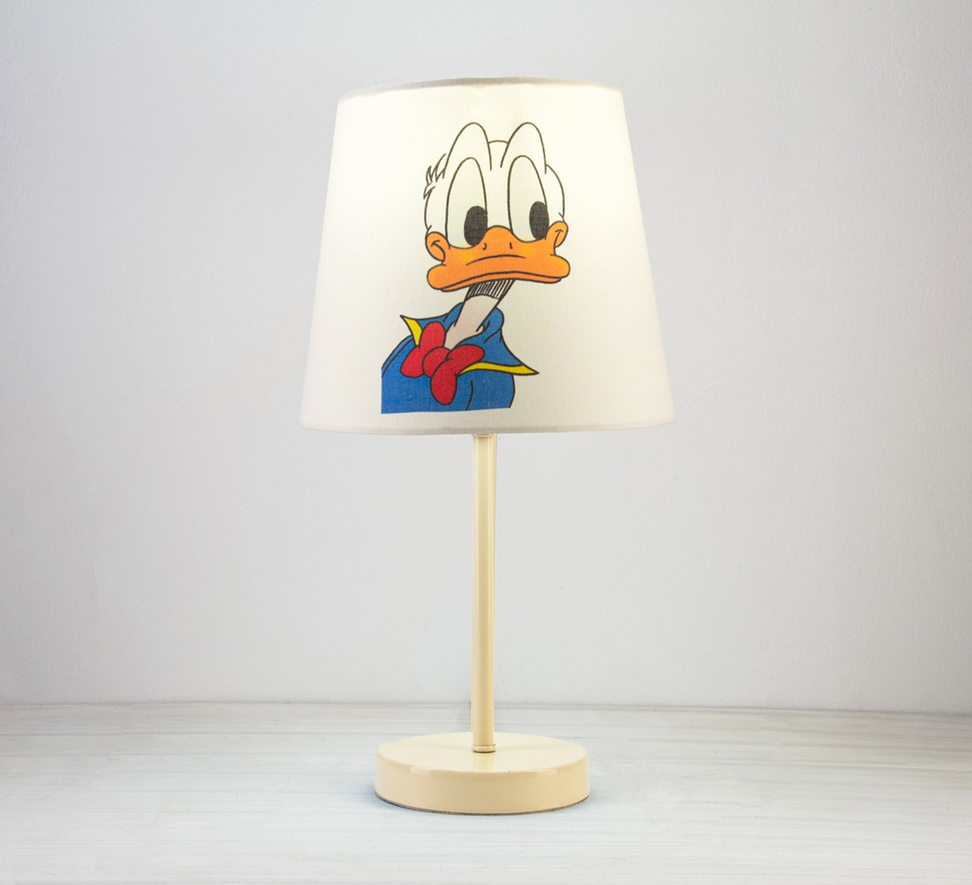 Donald Duck Lamp: A fun, classic touch for a nursery with a beige base. - Vitrine Furniture - Lighting