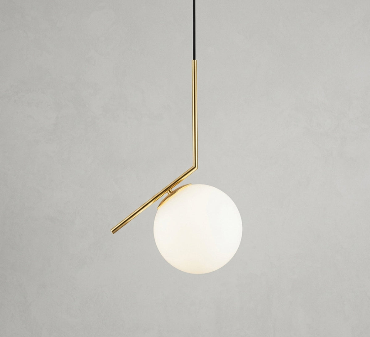 Gold pendant with an angled arm and a glass globe - Vitrine Furniture - Ceiling lights