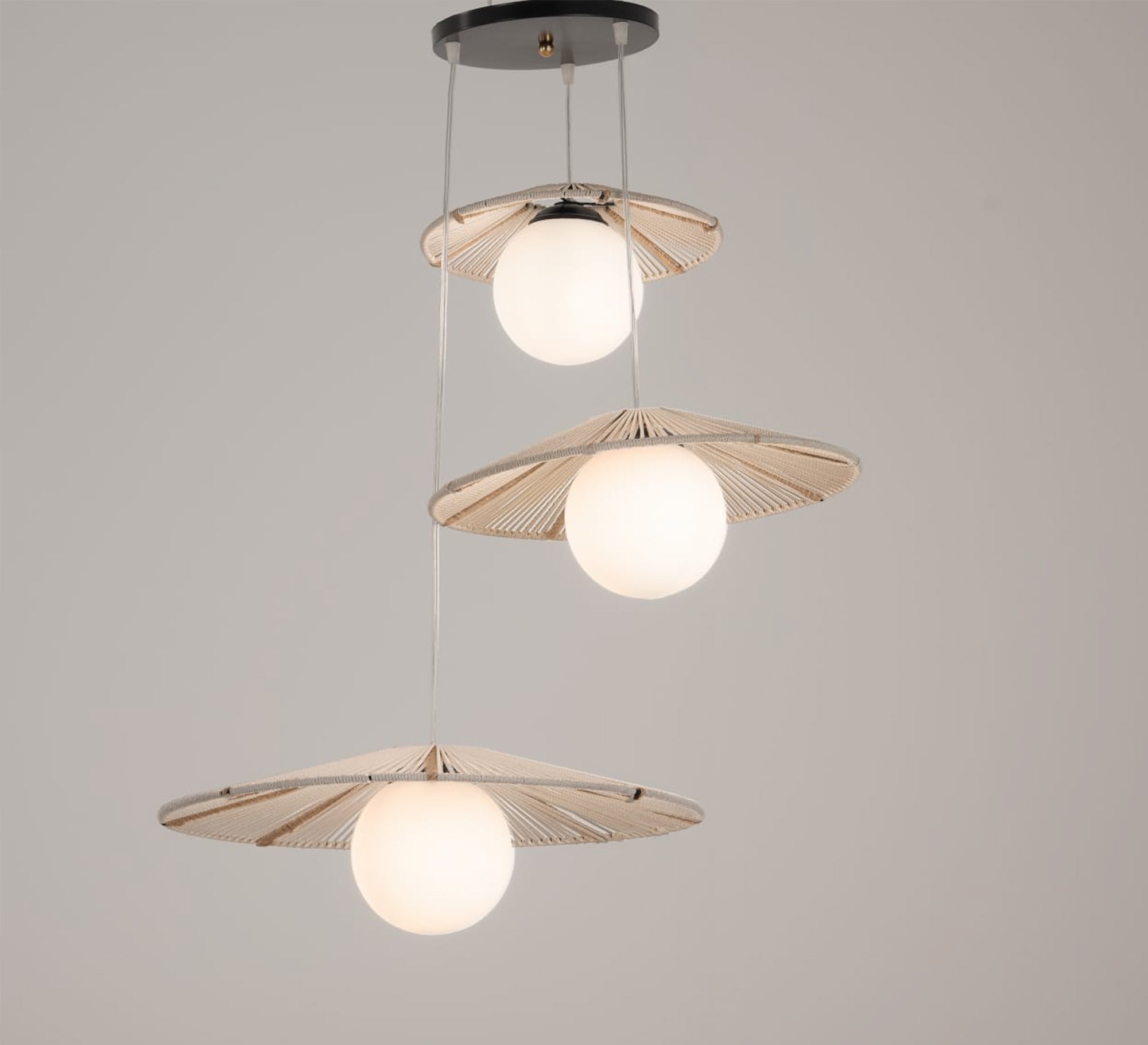 Three - light beige pendant lighting at different levels - Vitrine Furniture - Lighting