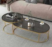 Two oval and one circular glass - topped tables - Vitrine Furniture - Furniture